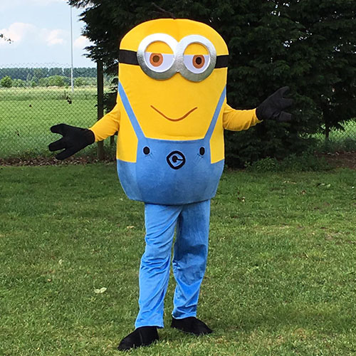 Person in minion suit standing in a grass field